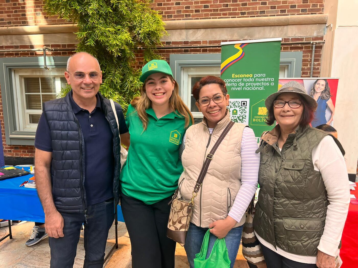 Clip field team greeting attendees at a Constructora Bolívar community event