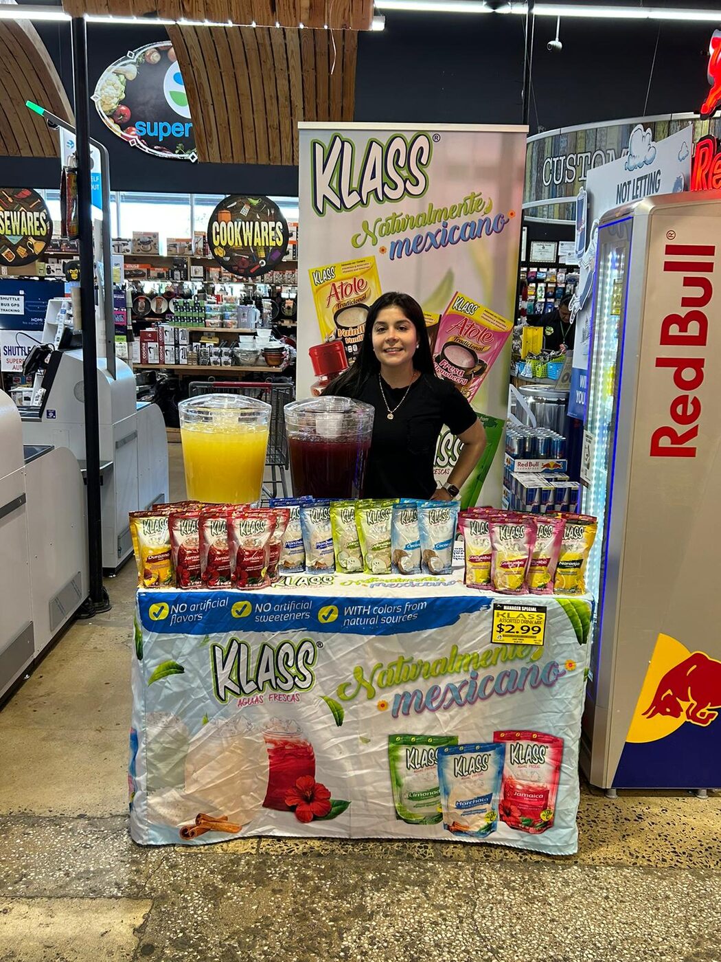 Klass aguas frescas demo table staffed by a Clip product educator