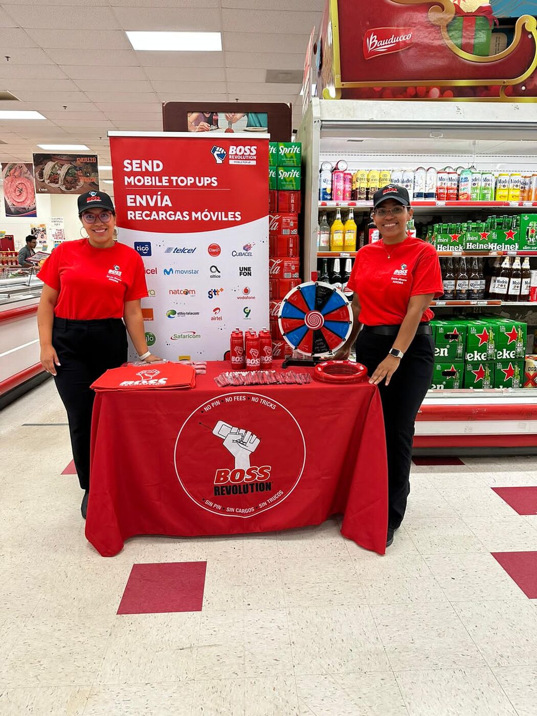 Two Boss Revolution brand ambassadors at a retail activation table